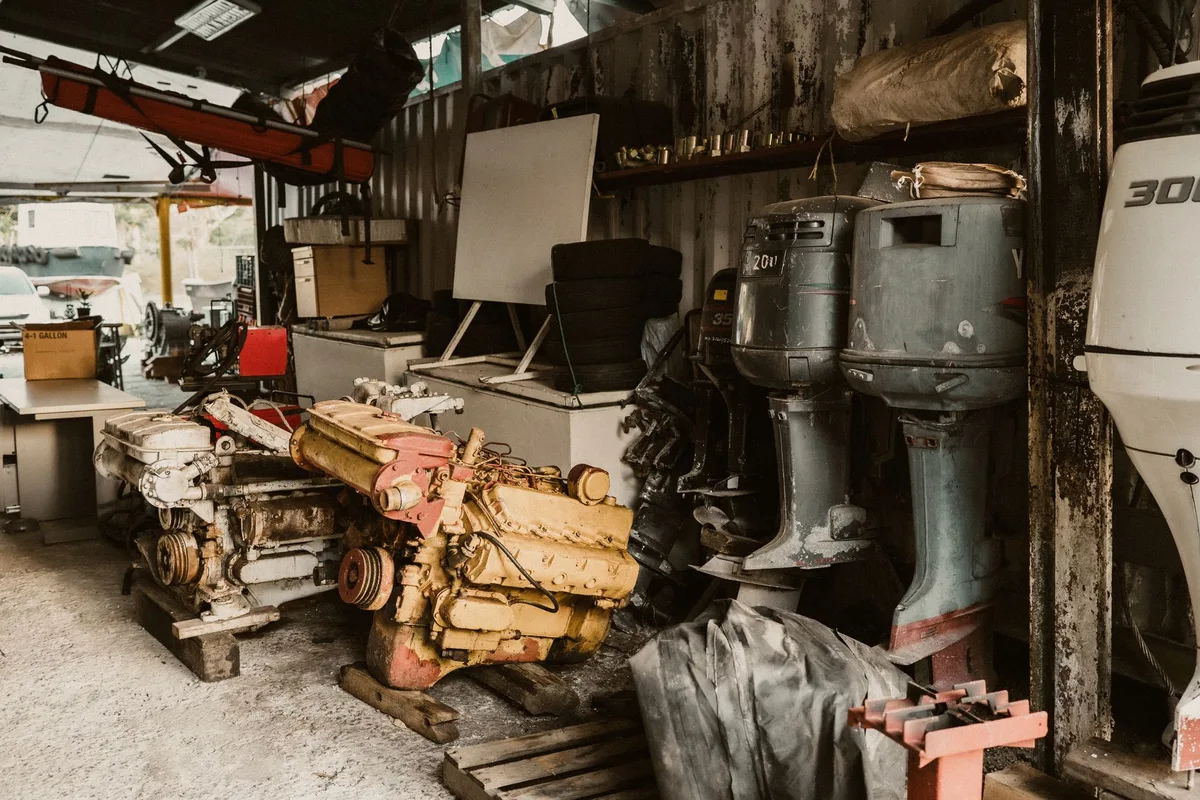 Marine Mechanic Inspecting Outboard Engine